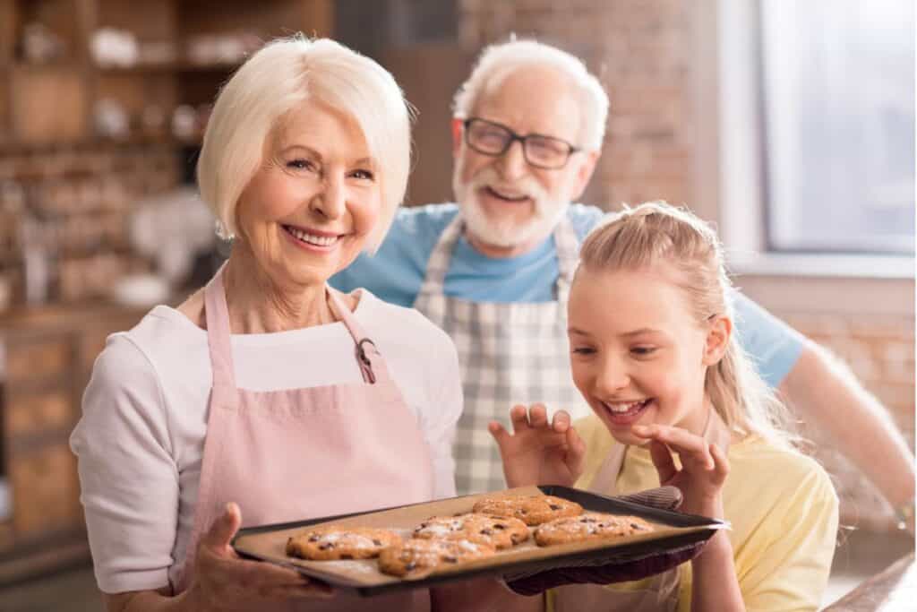 Grandma and her granddaughter baking.