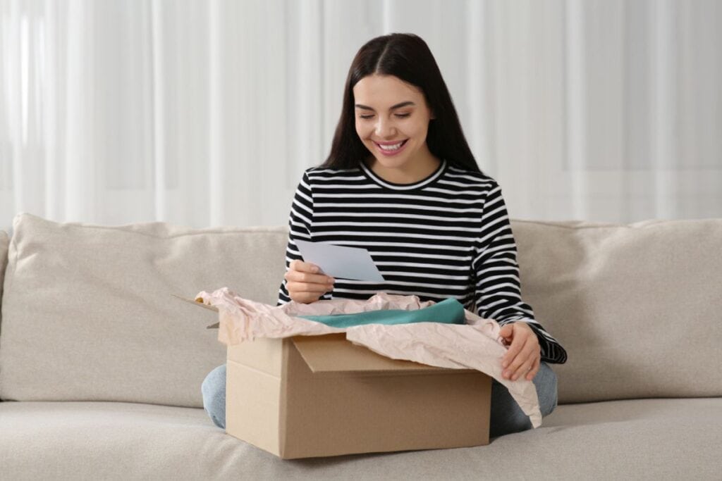 Young woman happy with her package.